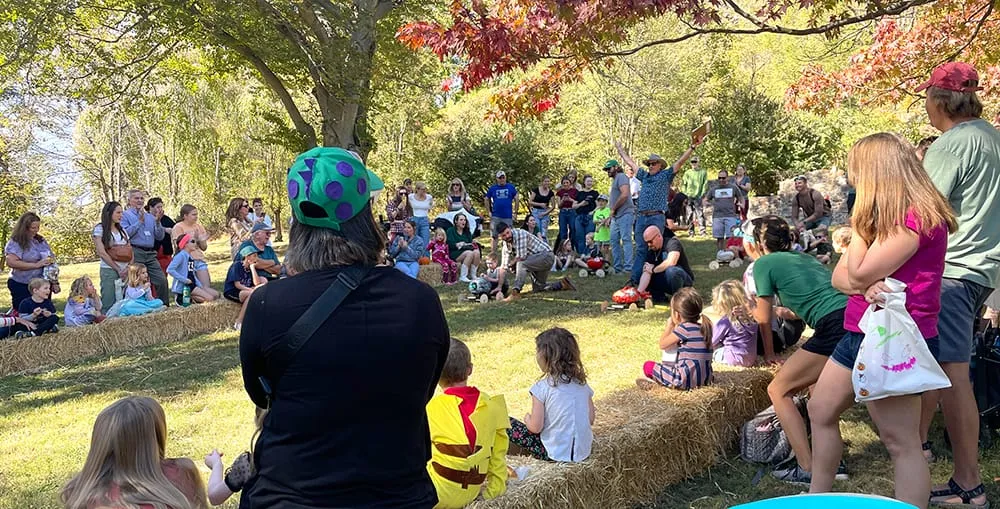 Families gathered around hay bales at Historic Yellow Springs’ fall festival